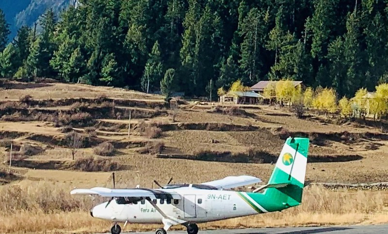 Handout image shows a Tara Air DHC-6 Twin Otter, tail number 9N-AET, in Simikot, Nepal December 1, 2021. Picture taken December 1, 2021. Madhu Thapa/Handout via REUTERS ATTENTION EDITORS - THIS IMAGE HAS BEEN SUPPLIED BY A THIRD PARTY. NO RESALES. NO ARCHIVES. MANDATORY CREDIT. THIS PICTURE WAS PROCESSED BY REUTERS TO ENHANCE QUALITY. AN UNPROCESSED VERSION HAS BEEN PROVIDED SEPARATELY.