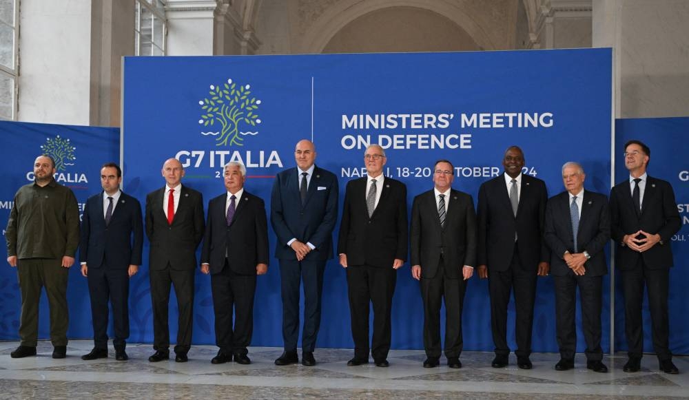 (From L) Ukraine's Defence Minister Rustem Umerov, France's Defence Minister Sebastien Lecornu, Great Britain's Defence Minister John Healey, Japan's incoming Defence Minister Gen Nakatani, Italy's Defence Minister Guido Crosetto, Canada's Defence Minister Bill Blair, German Defence Minister Boris Pistorius, US Secretary of Defense Lloyd Austin, High Representative of the European Union for Foreign Affairs and Security Policy Josep Borrell and NATO Secretary General Mark Rutte pose for a family photograph as part of the Group of Seven (G7) Defence Ministers Summit at the Palazzo Reale in Naples, Italy, on October 19, 2024. (Photo by Tiziana FABI / AFP)