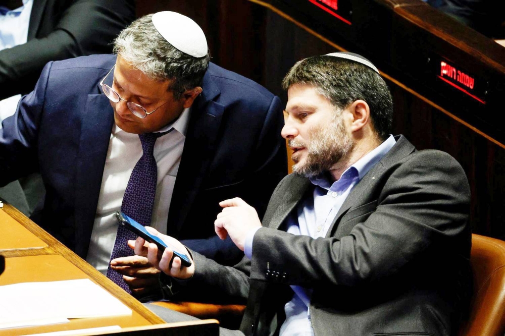 Israeli right-wing Knesset members Itamar ben Gvir and Bezalel Smotrich attend a session at the plenum at the Knesset, Israel's parliament in Jerusalem December 28, 2022. REUTERS/Ammar Awad